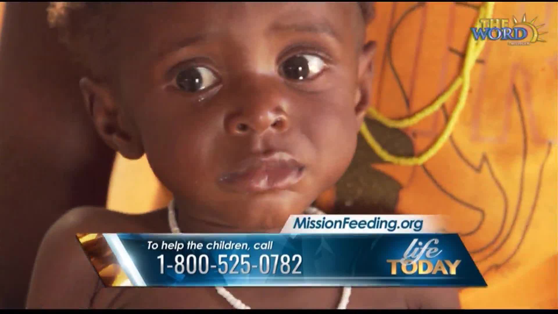 A young child's face is the focus, eyes wide and looking upward. A banner at the bottom displays a phone number for MissionFeeding.org, a Life Today initiative.