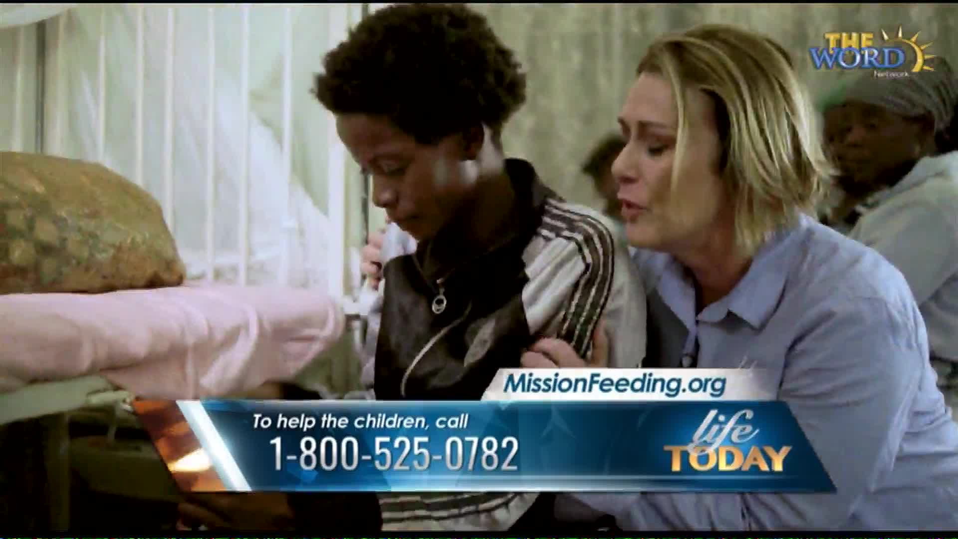 A woman places her hand on a young boy's shoulder, her face etched with concern. A graphic overlay displays a phone number for MissionFeeding.org, a program associated with The Word Network and Life Today.