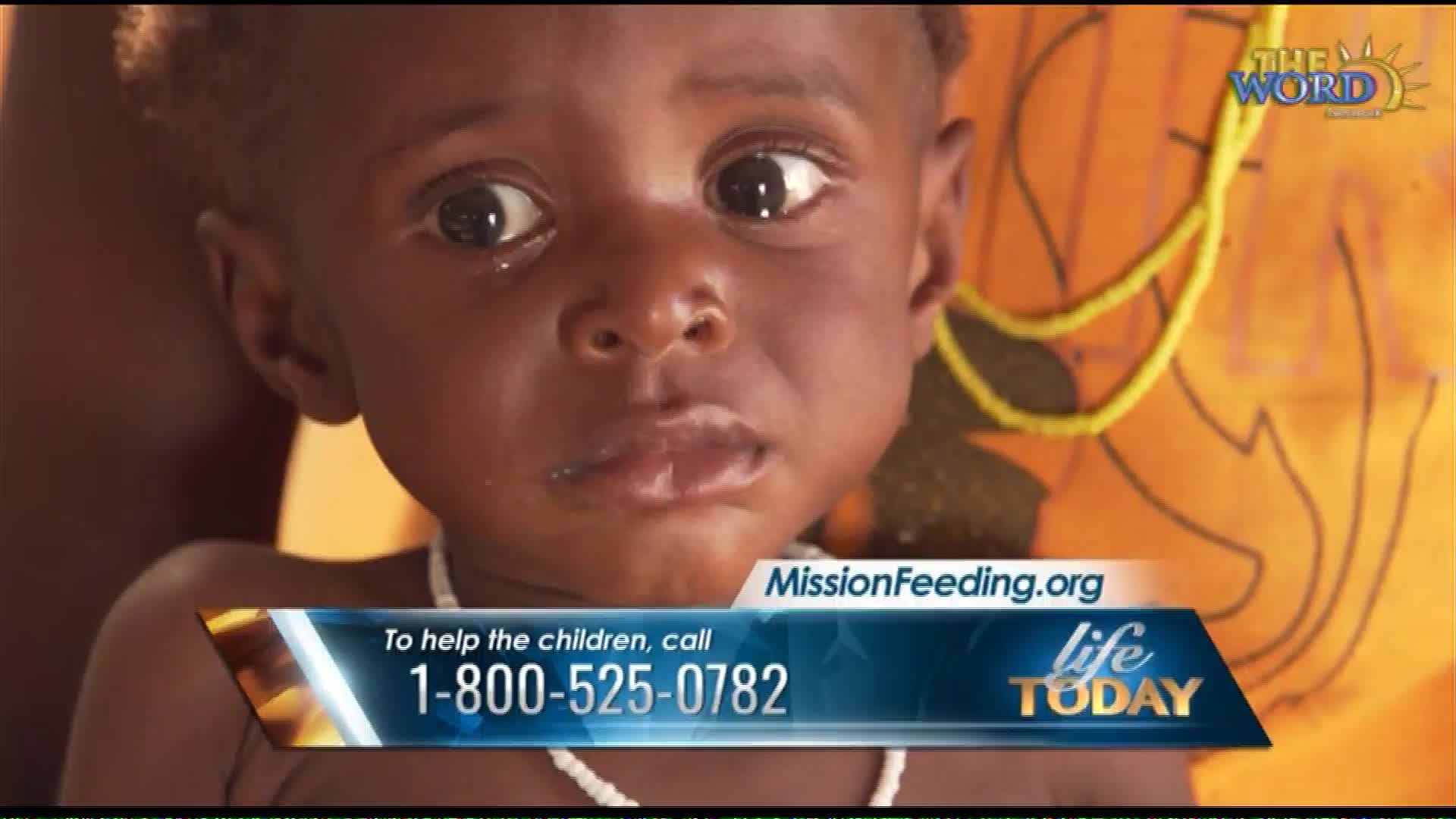 A young child's face fills the screen, eyes wide and glistening. A graphic overlay displays a toll-free number for MissionFeeding.org, a ministry that partners with organizations like Life Today to provide aid.
