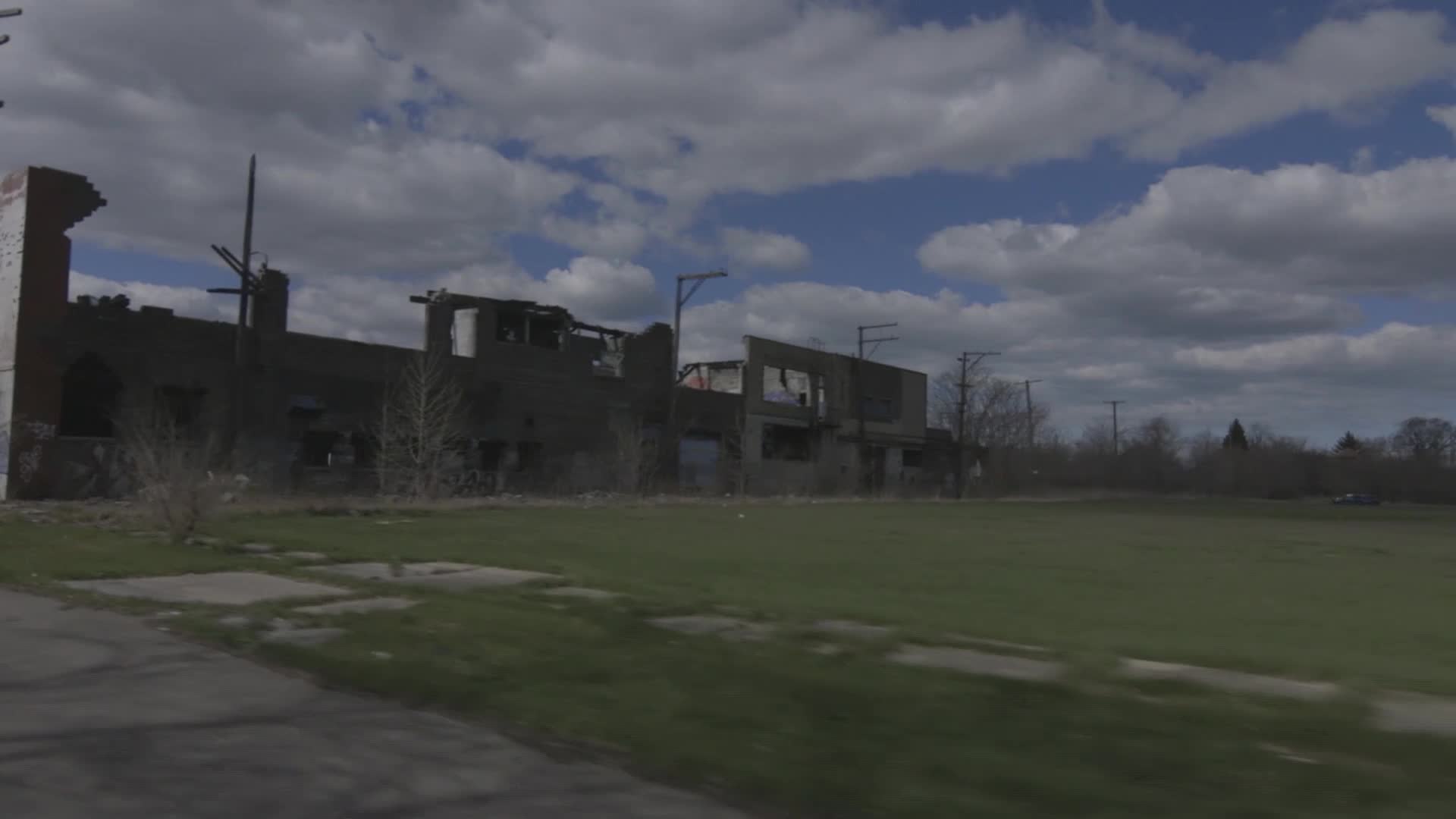 The remains of a brick building, its roof and walls partially collapsed, stand against a cloudy sky. Patches of grass and weeds cover the ground in front of the structure.
The remains of a brick building, its roof and walls partially collapsed, stand against a cloudy sky. Patches of grass and weeds cover the ground in front of the structure.