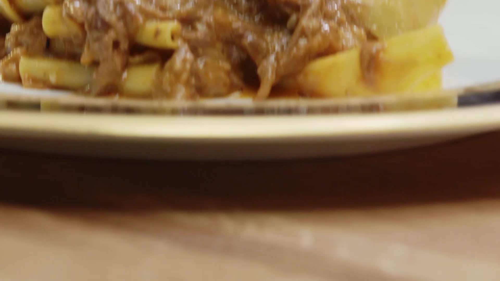 Thick tubes of pasta are piled high, smothered in a rich, meaty sauce. It looks like something you'd find on a VICE TV show about American comfort food.