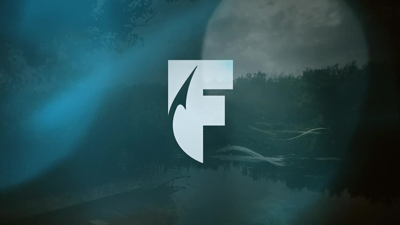 The logo of the World Fishing Network, a stylized "F," is centered against a backdrop of a dark, moody landscape. Reflections ripple across the water, and a hazy moon hangs in the sky.
