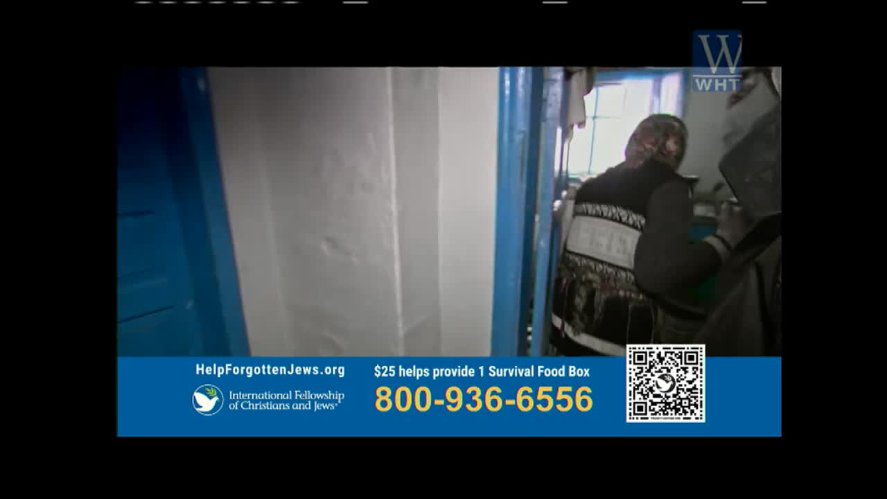 A person in a patterned vest stands inside a room, partially obscured by a doorway. The scene is framed by a blue border, and the World Harvest TV logo is in the corner.
