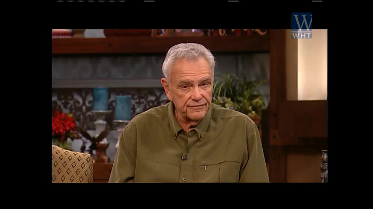 A man with gray hair and a green shirt is seated, looking directly at the camera. The World Harvest TV logo is visible in the top right corner.
