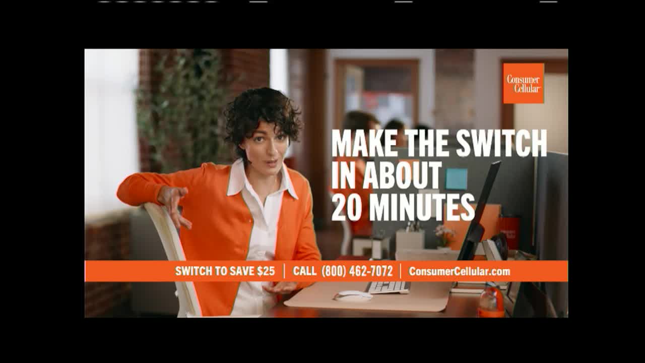On World Harvest TV, a woman in an orange jacket gestures towards the viewer while seated at a desk. The words "Make the Switch in About 20 Minutes" are prominently displayed above her.
