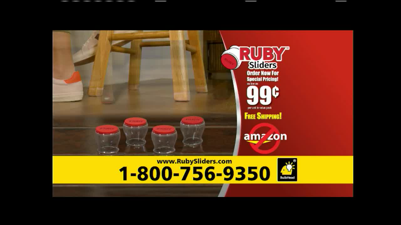 A foot in a white sneaker is near a wooden chair, and some plastic containers with red lids are lined up on the floor. The commercial for Ruby Sliders on World Harvest TV is advertising a special price.
