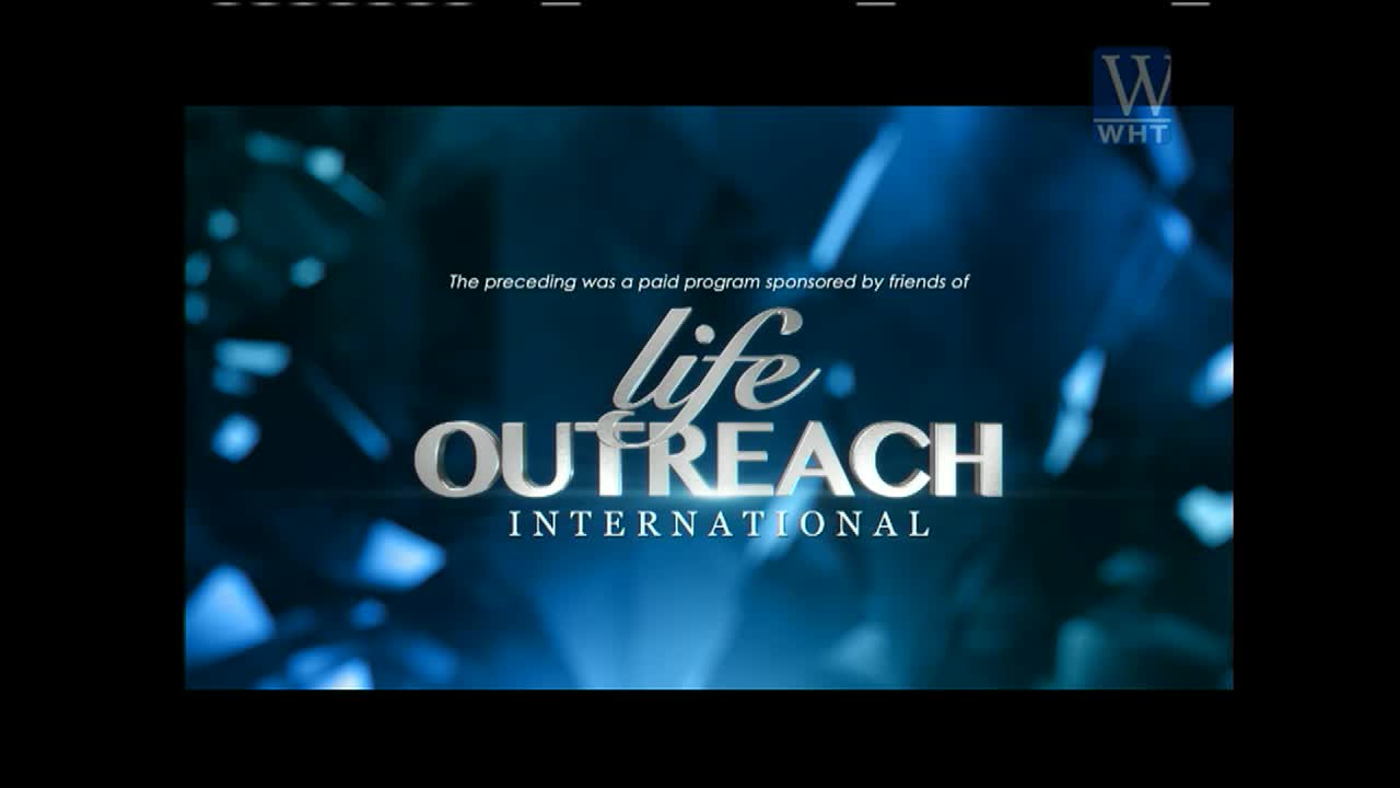 The words "life OUTREACH INTERNATIONAL" shine in silver against a blurred blue background. Above, a disclaimer states the program was paid for, and the World Harvest TV logo sits in the corner.

