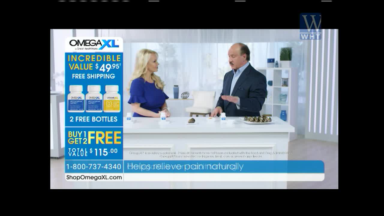 On World Harvest TV, a man in a suit gestures towards a table, while a woman in a blue dress looks on. The table displays bottles of OmegaXL, and the bottom of the screen advertises the product.
