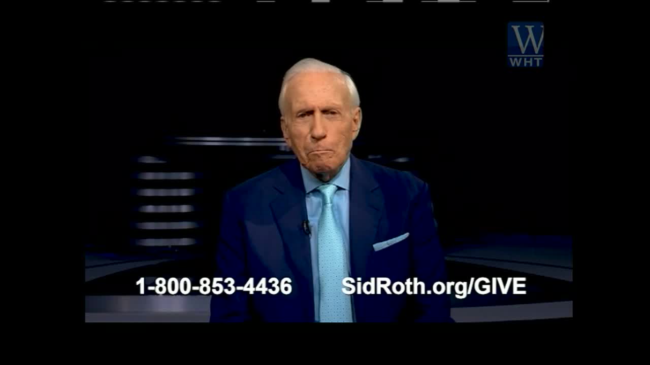 On the screen, a man in a blue suit and tie is speaking, his expression serious. Below him, contact information and a website are displayed, likely for a program on World Harvest Television.
