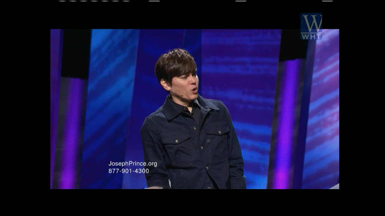 A man in a dark blue jacket speaks animatedly on a stage. The World Harvest TV logo appears in the upper right corner.