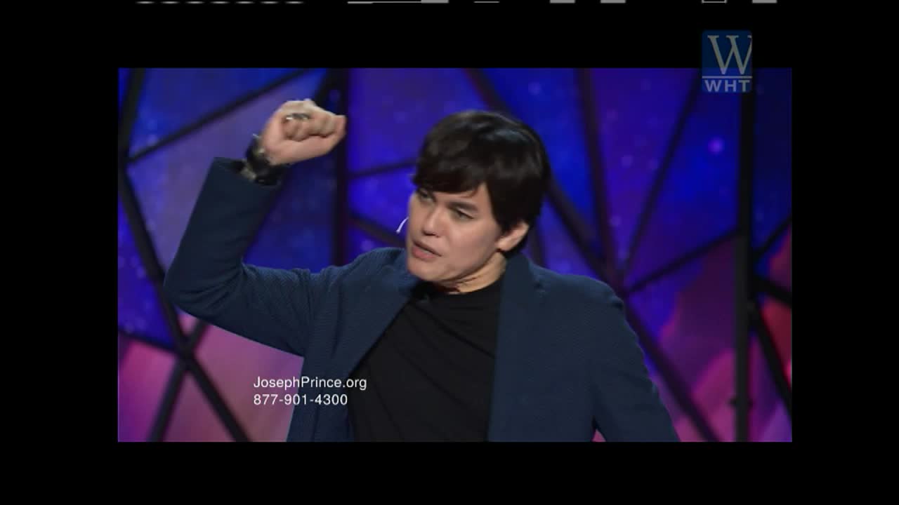 A man in a dark suit gestures with his right fist raised, speaking with conviction. The World Harvest Television logo appears in the upper right corner.