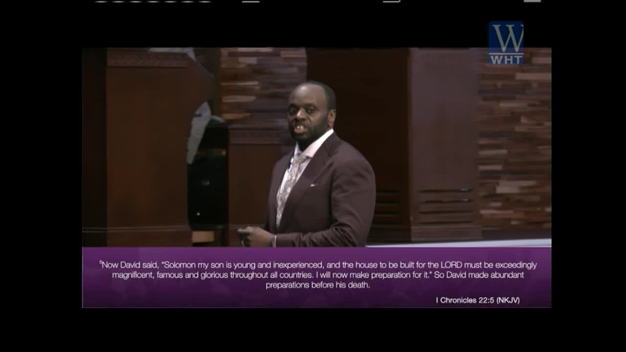 A man in a suit speaks from a stage, his hands gesturing. A Bible verse appears on screen, attributed to 1 Chronicles 22:5.