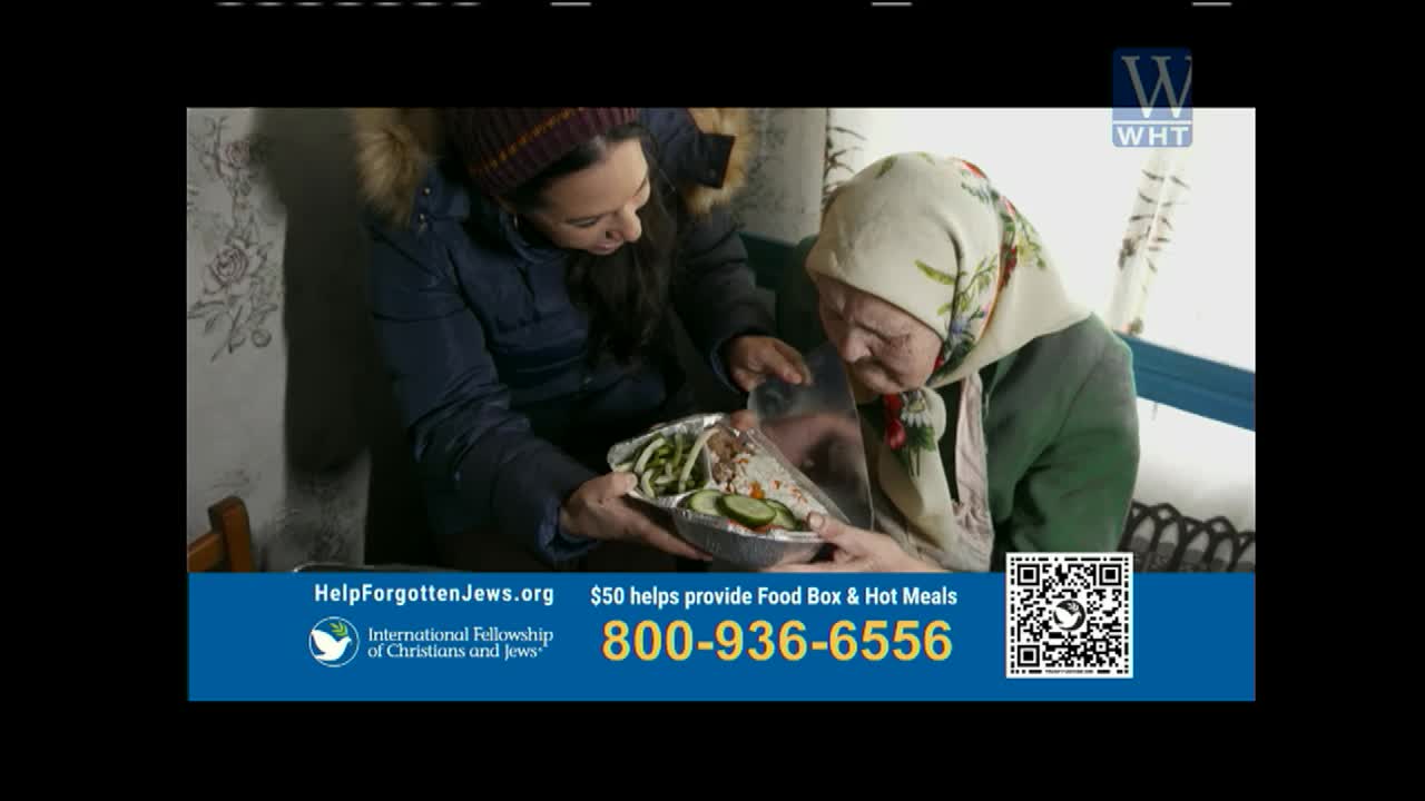 A woman in a blue coat offers a foil container of food to an older woman wearing a headscarf. The World Harvest Television logo appears in the upper right corner.