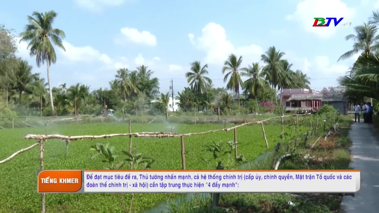 Water sprays across a field of green plants, likely crops, as the sun shines. A Bac Lieu TV logo sits in the corner, with Vietnamese text displayed below.
