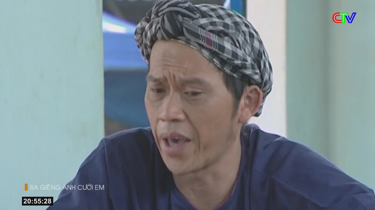 A man with a checkered headscarf speaks intently, his brow furrowed. The Ca Mau TV logo appears in the corner of the screen.