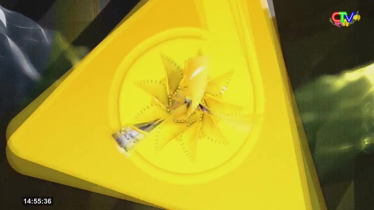 A bright yellow, star-shaped object spins in the center of the screen, its metallic edges catching the light. The Ca Mau TV logo hovers in the upper right corner.