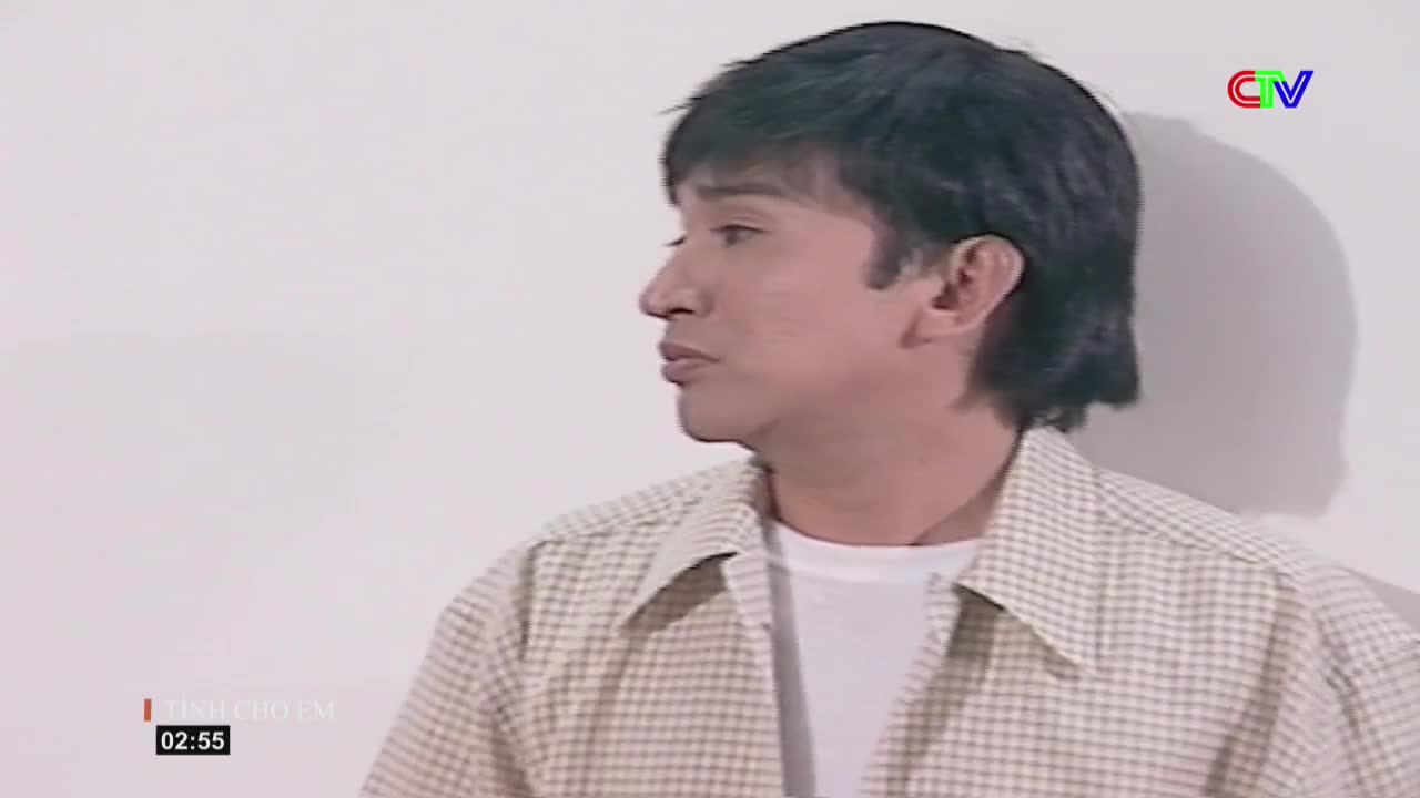 A man in a plaid shirt turns his head to the side, speaking. The Ca Mau TV logo is visible in the corner, and a timestamp reads 02:55.