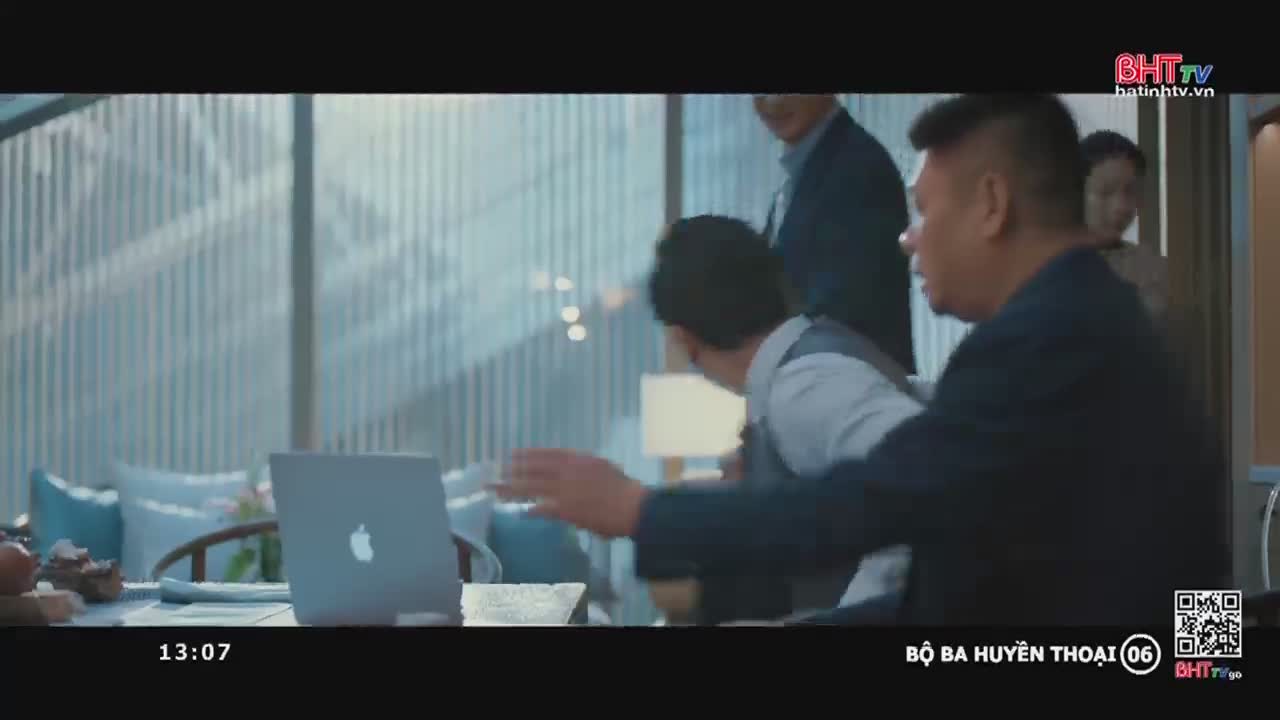 A man in a dark suit gestures urgently, his hand reaching toward a laptop on the table. Behind him, others watch the scene unfold, as if something unexpected has just happened.
A man in a dark suit gestures urgently, his hand reaching toward a laptop on the table. Behind him, others watch the scene unfold, as if something unexpected has just happened.