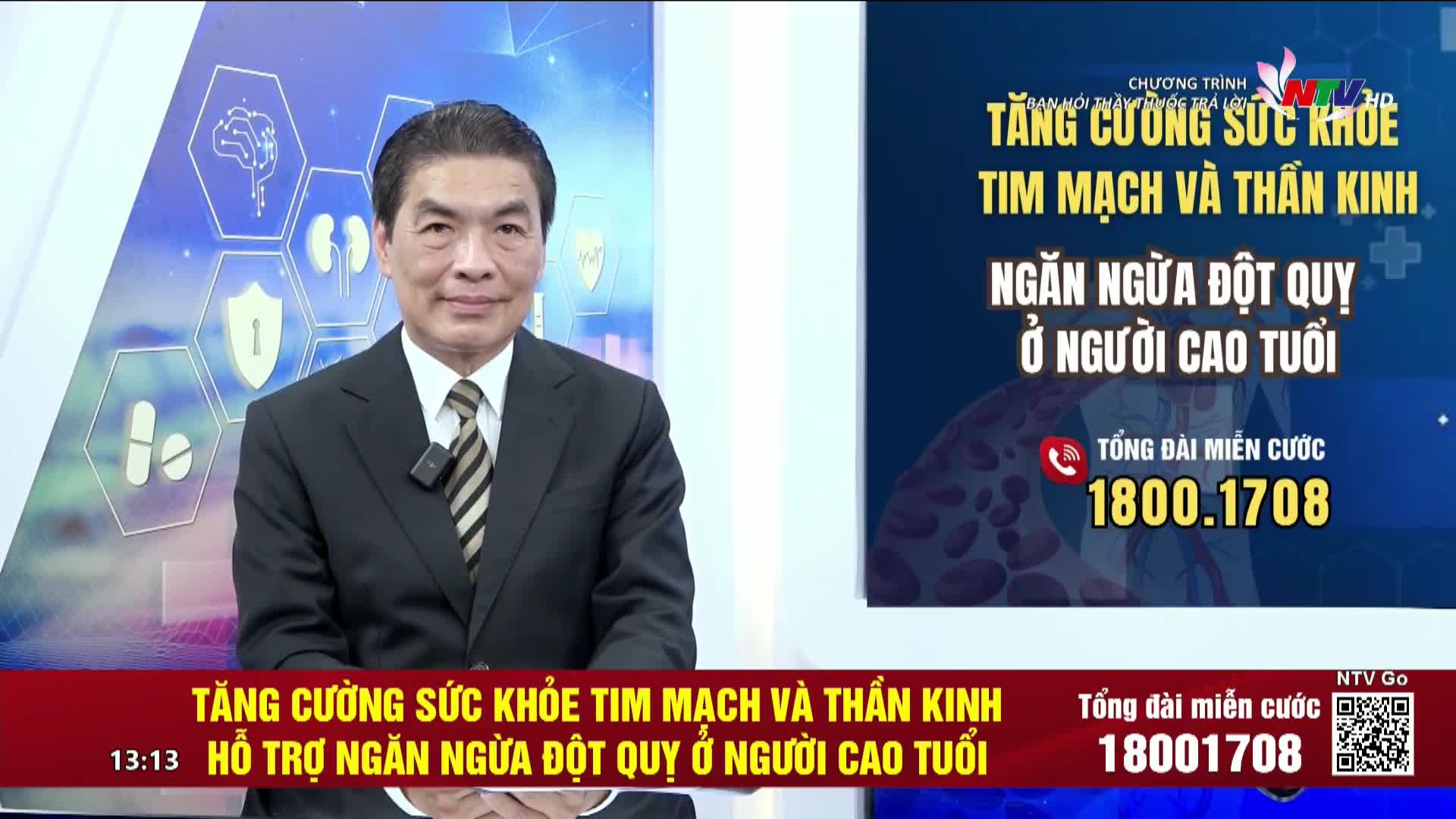A man in a suit, speaking, is centered on a screen for Nghe An TV in Vietnam. The program's title, "Strengthening Cardiovascular and Nervous System Health," is displayed with a phone number for viewers.

