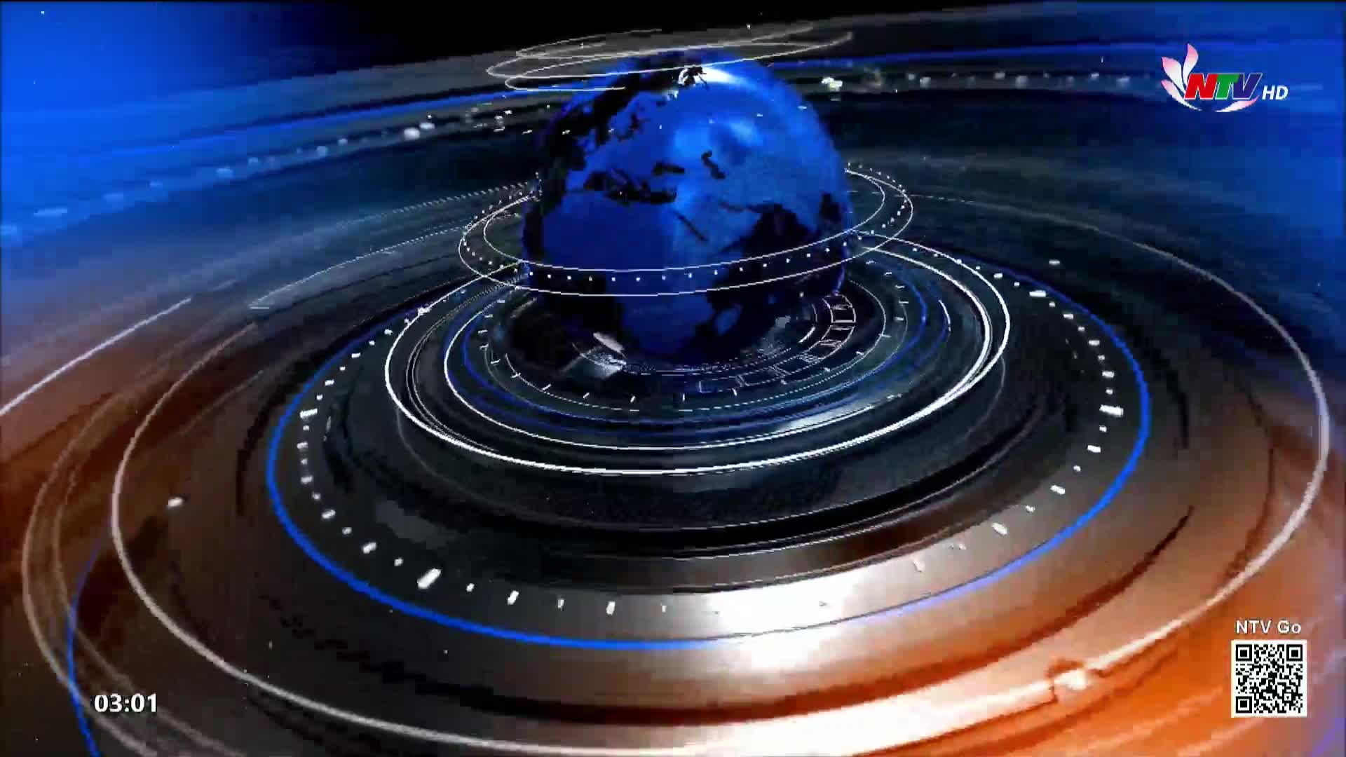 A blue globe spins slowly, surrounded by concentric rings of light and shadow. The NTV HD logo appears in the upper right corner, and the time reads 03:01.