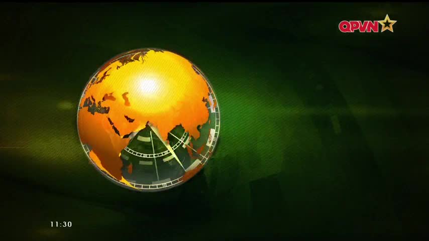 A glowing, golden globe dominates the screen, with the QPVN logo in the upper right. The time, 11:30, sits in the lower left corner.
