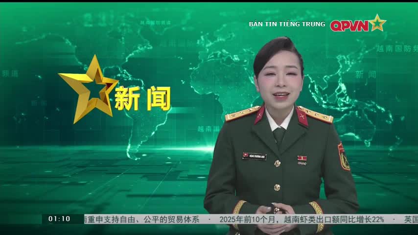 A woman in a military uniform speaks, her face lit by the studio lights. Behind her, a map of the world is displayed, along with Chinese characters and the QPVN logo.
A woman in a military uniform speaks, her face lit by the studio lights. Behind her, a map of the world is displayed, along with Chinese characters and the QPVN logo.