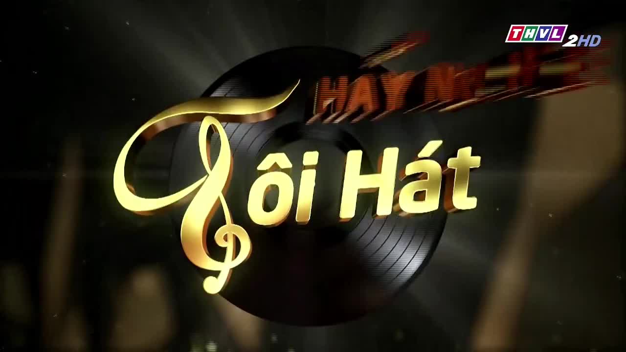 A golden treble clef and the words "Tôi Hát" shimmer in the light, set against a dark background. The logo for Tra Vinh TV, THVL 2HD, is visible in the top right corner, indicating the show's origin.
