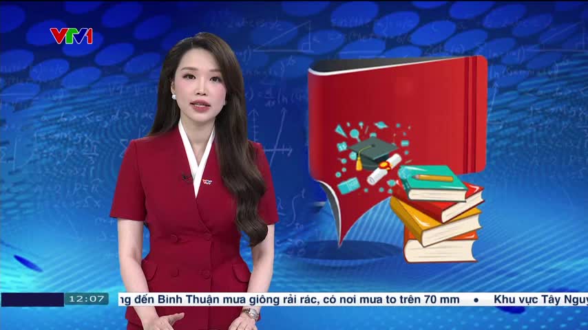 A woman in a red suit is speaking, framed by a blue background with graphics. Beside her, a cartoon book with academic symbols floats.
